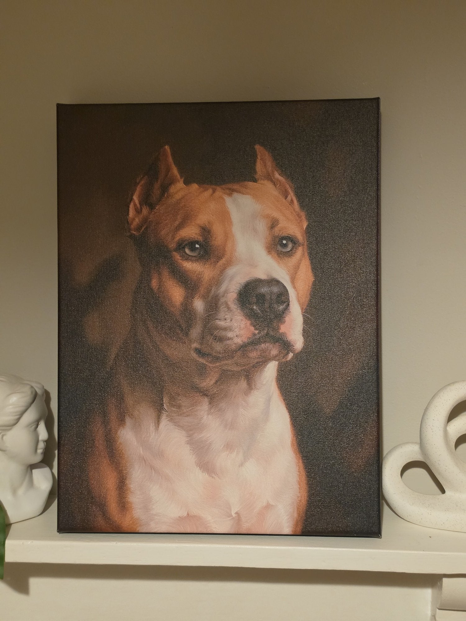 Kaya's memorial portrait printed on museum canvas, gallery-wrapped and hung on a wall in evening light